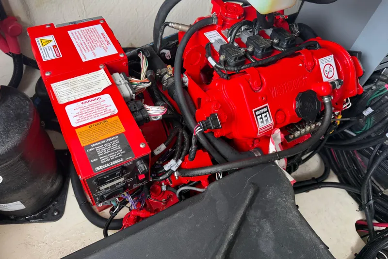 Monet Yacht Photos Pics Engine compartment of a 2021 Regal 36 XO boat, featuring red components and wiring.