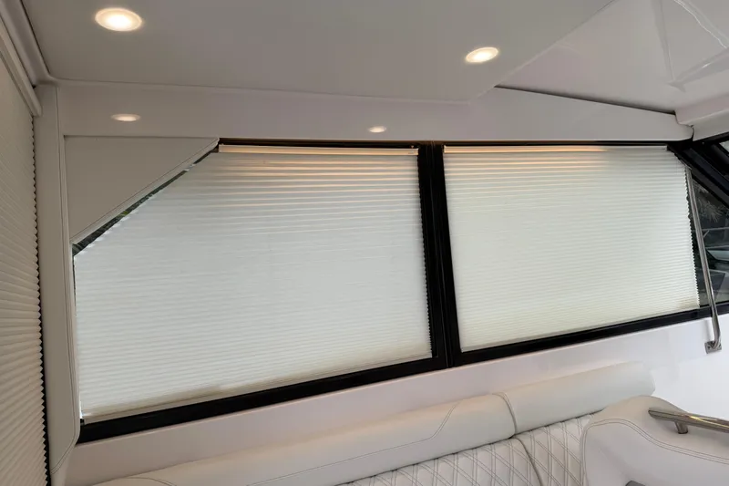 Monet Yacht Photos Pics Interior of 2021 Regal 36 XO yacht with modern window blinds and seating.
