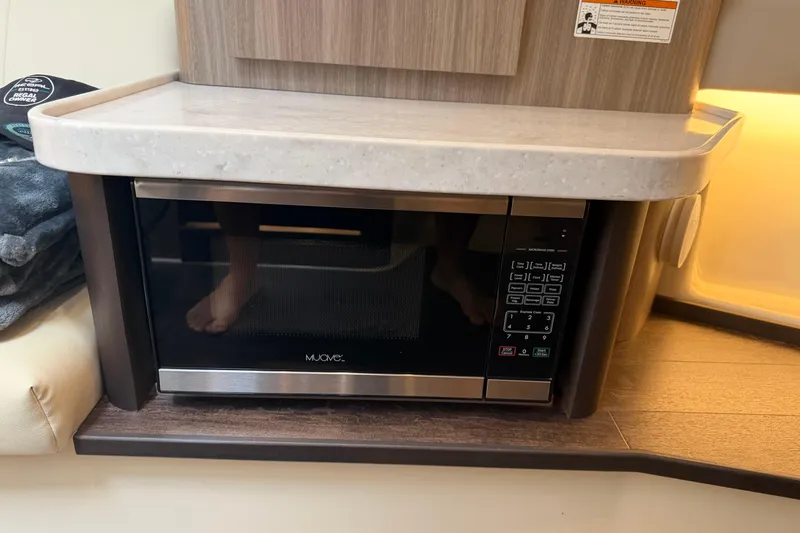 Monet Yacht Photos Pics Microwave in 2021 Regal 36 XO yacht interior, under a sleek countertop.