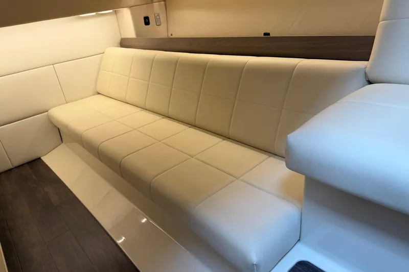 Monet Yacht Photos Pics Luxurious interior seating of 2021 Regal 36 XO yacht with cream upholstery.