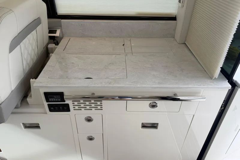 Monet Yacht Photos Pics 2021 Regal 36 XO yacht interior with sleek countertop and modern cabinetry.