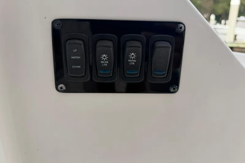 Monet Yacht Photos Pics Control panel on a 2021 Regal 36 XO boat with labeled switches.