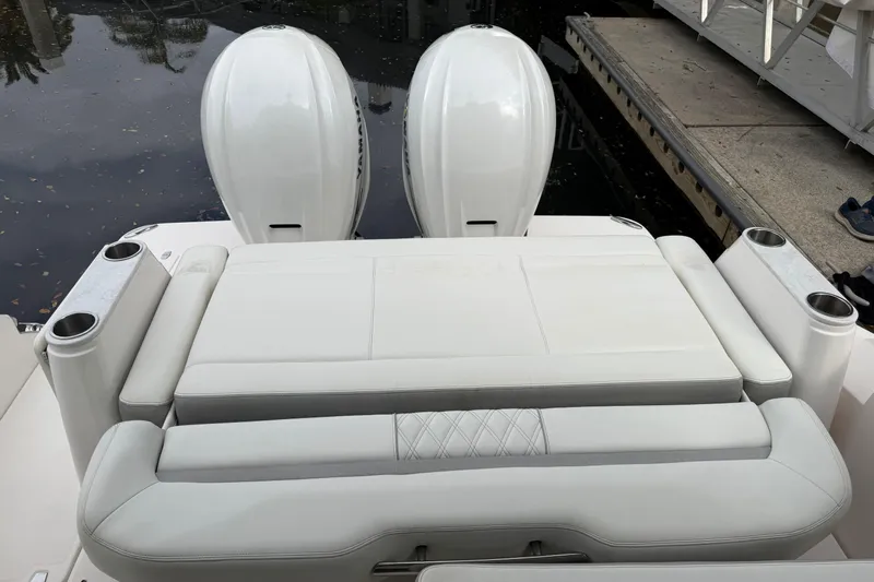 Monet Yacht Photos Pics 2021 Regal 36 XO boat with dual outboard engines and cushioned seating.