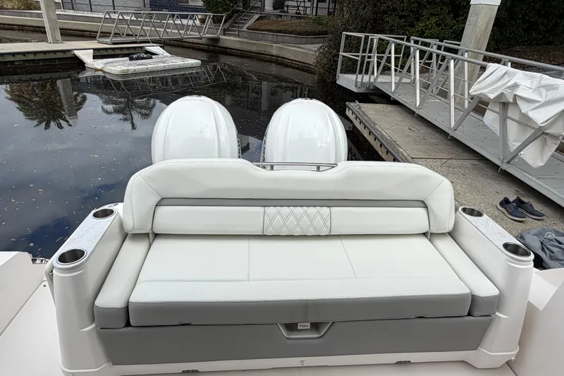 Monet Yacht Photos Pics 2021 Regal 36 XO boat with white seating and dual outboard motors at a dock.