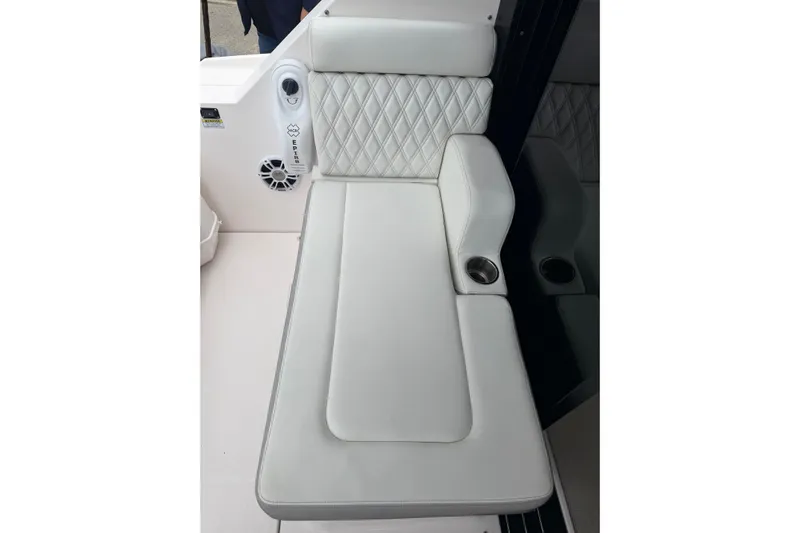 Monet Yacht Photos Pics Luxurious white seating on 2021 Regal 36 XO boat with cup holder and speaker.