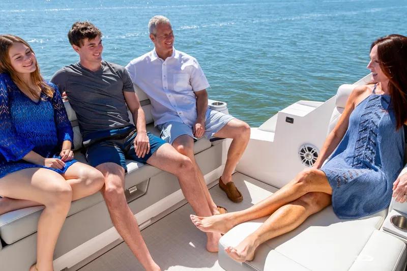 Monet Yacht Photos Pics People relaxing on a 2021 Regal 36 XO boat, enjoying a sunny day on the water.