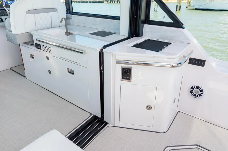 Monet Yacht Photos Pics 2021 Regal 36 XO yacht interior with sleek kitchen and modern amenities.