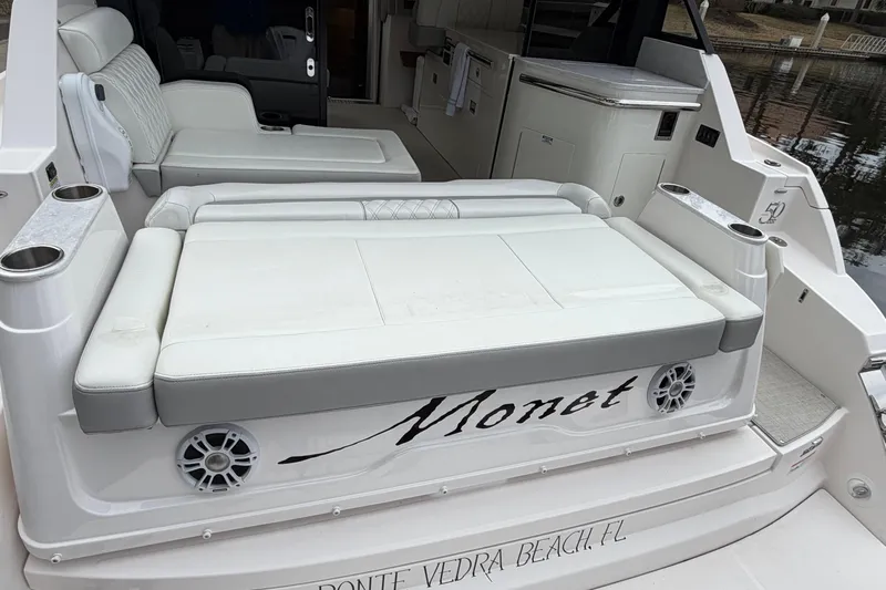 Monet Yacht Photos Pics 2021 Regal 36 XO yacht with white seating and cup holders, docked at Ponte Vedra Beach.