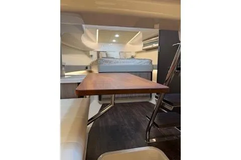 Monet Yacht Photos Pics Interior of 2021 Regal 36 XO yacht featuring a cozy cabin and dining area.