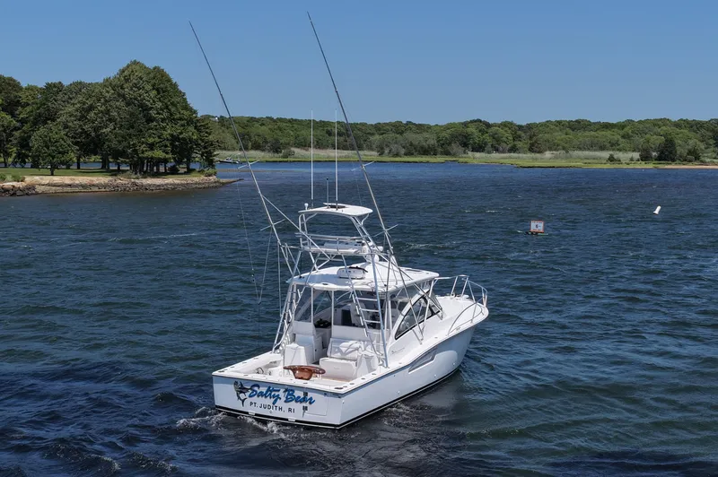 Salty Bear Yacht Photos Pics 2022 Albemarle 360 Express Fisherman boat on a scenic lake with lush green shoreline.