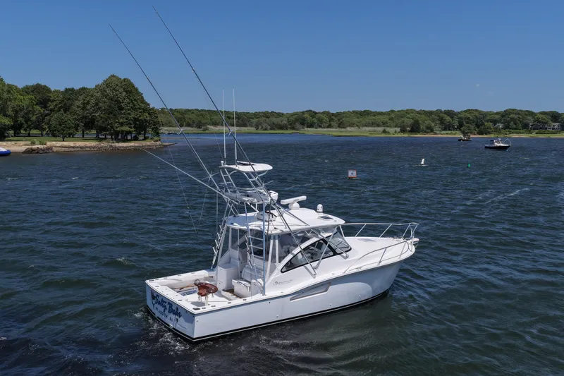 Salty Bear Yacht Photos Pics 2022 Albemarle 360 Express Fisherman boat cruising on a scenic lake.
