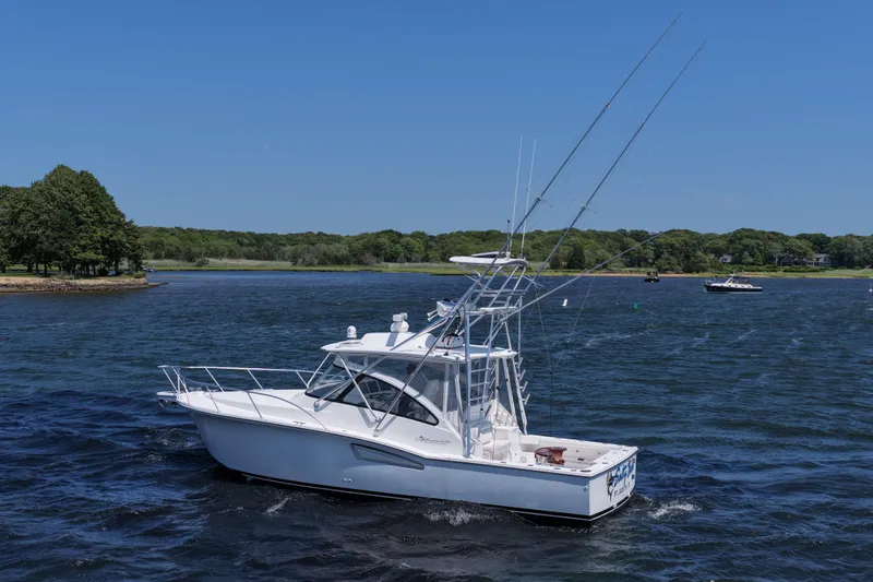 Salty Bear Yacht Photos Pics 2022 Albemarle 360 Express Fisherman boat cruising on a scenic lake.