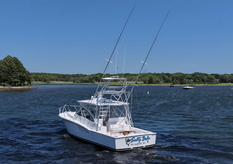 Salty Bear Yacht Photos Pics 2022 Albemarle 360 Express Fisherman boat on a scenic lake with clear blue skies.