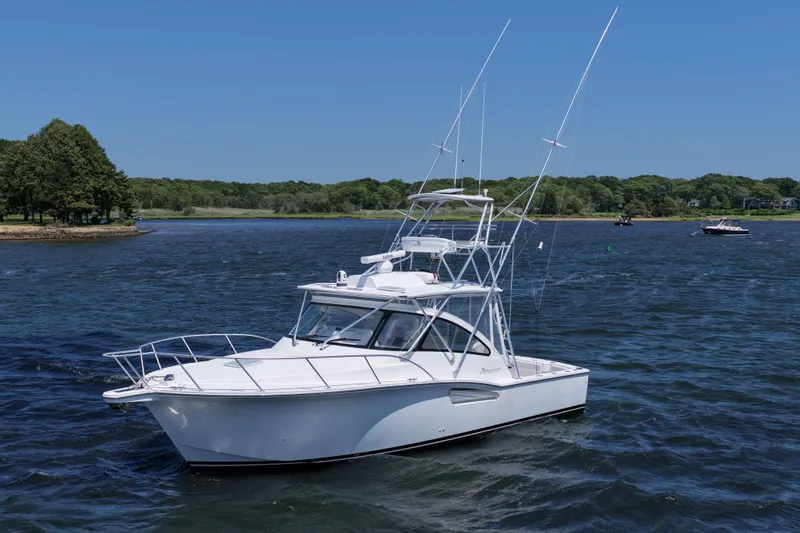 Salty Bear Yacht Photos Pics 2022 Albemarle 360 Express Fisherman boat on a scenic lake with trees in the background.