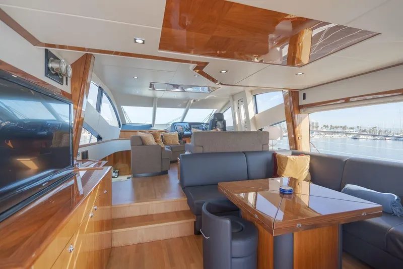  Yacht Photos Pics Luxurious interior of 2010 Sunseeker Manhattan 60 yacht with elegant wood finishes.