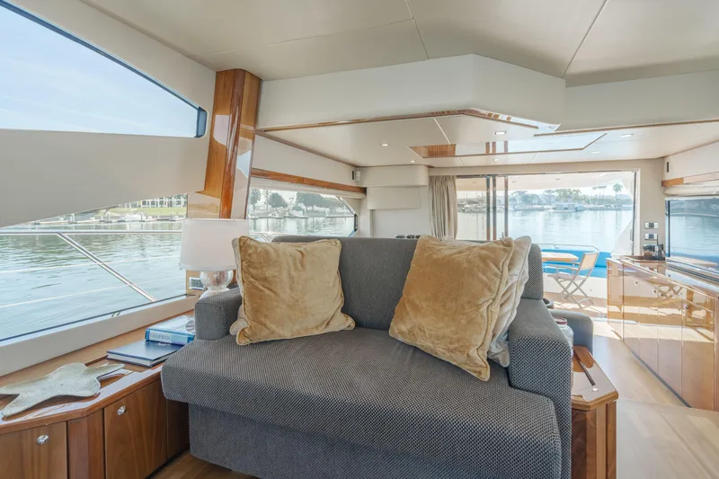  Yacht Photos Pics Luxurious interior of 2010 Sunseeker Manhattan 60 yacht with elegant seating and waterfront view.