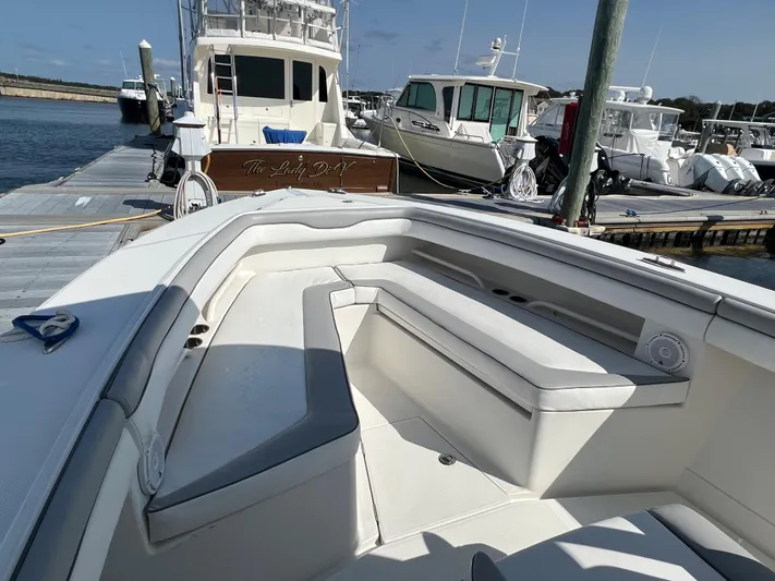 American Made Yacht Photos Pics 2013 Jupiter 30 FS boat with spacious seating at a marina dock.