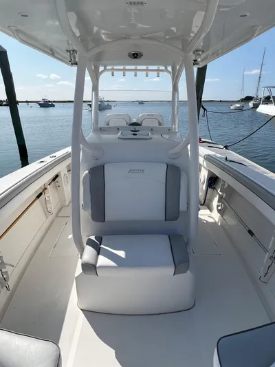 American Made Yacht Photos Pics 2013 Jupiter 30 FS boat interior with seating, docked in a marina.