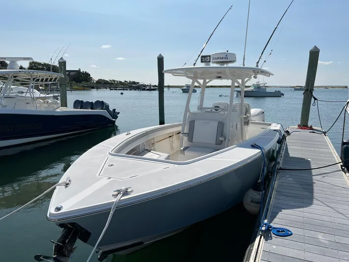 American Made Yacht Photos Pics 2013 Jupiter 30 FS boat docked in a marina under clear skies.