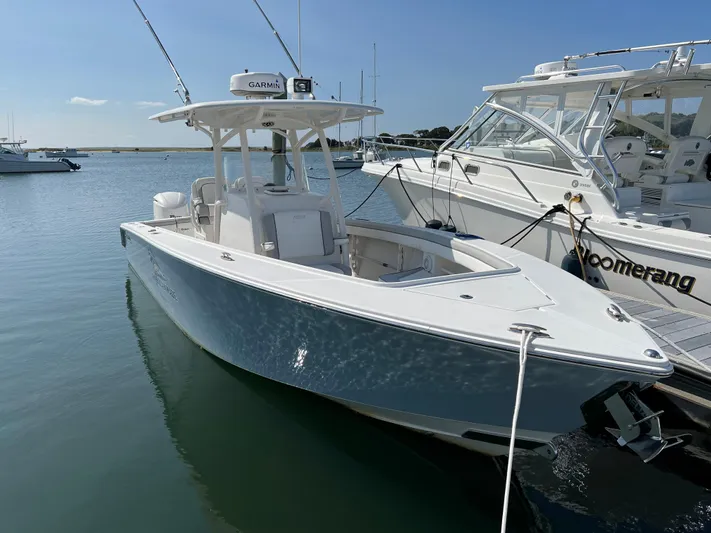 American Made Yacht Photos Pics 2013 Jupiter 30 FS boat docked in a marina under clear blue skies.