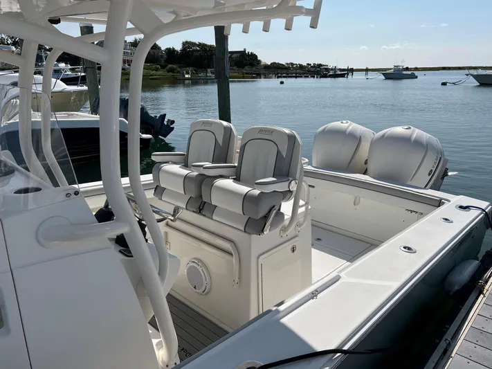 American Made Yacht Photos Pics 2013 Jupiter 30 FS boat with dual engines docked in a serene marina setting.