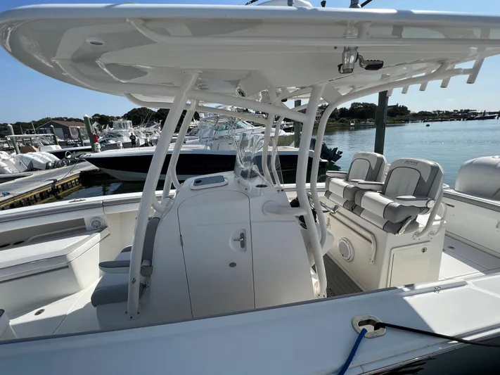 American Made Yacht Photos Pics 2013 Jupiter 30 FS boat with sleek design, spacious seating, and modern amenities docked by the water.