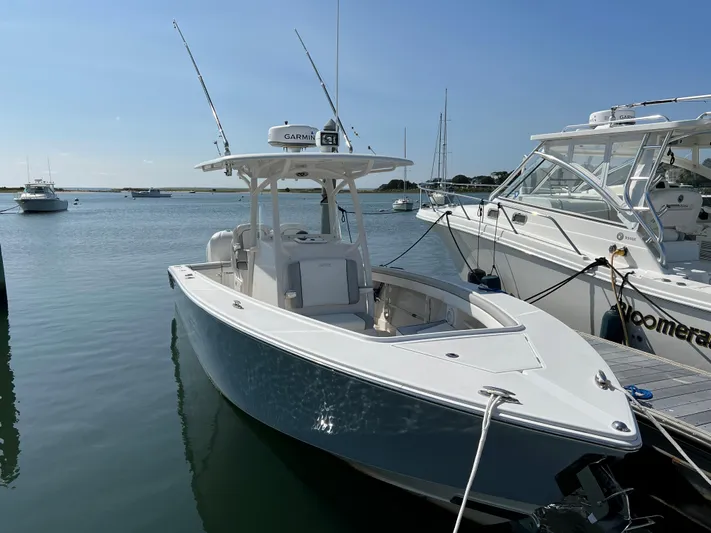 American Made Yacht Photos Pics 2013 Jupiter 30 FS boat docked in a marina under clear blue skies.