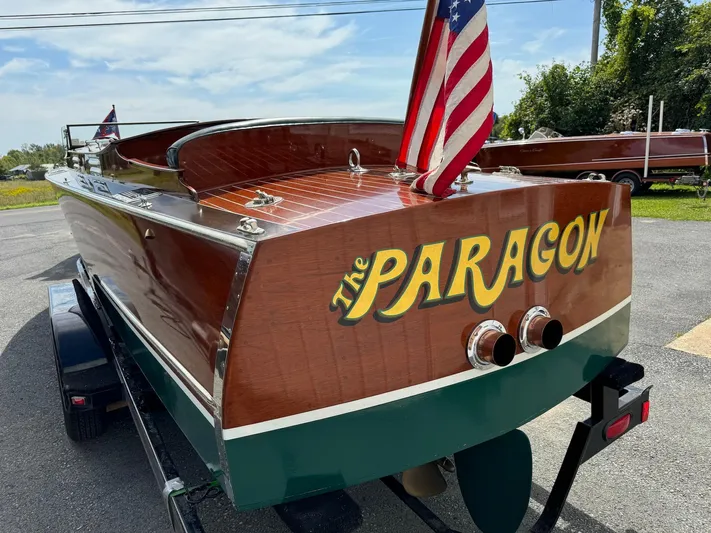 The Paragon Yacht Photos Pics 1929 Chris-Craft 26 Upswept Triple Cockpit boat, "The Paragon," on trailer with American flag.