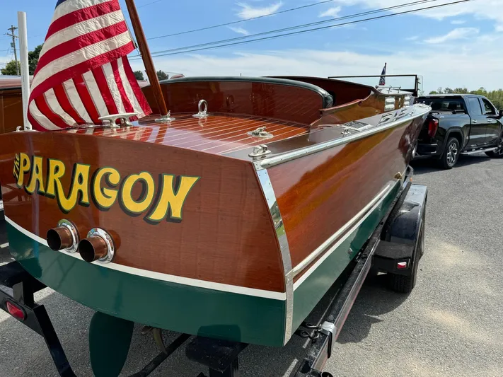 The Paragon Yacht Photos Pics 1929 Chris-Craft 26 Upswept Triple Cockpit boat with "Paragon" name and American flag.