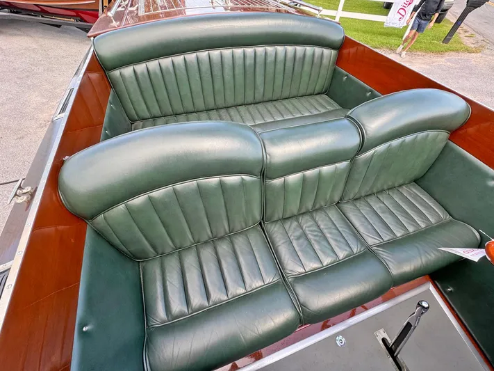 The Paragon Yacht Photos Pics 1929 Chris-Craft 26 Upswept Triple Cockpit with green leather seats and wooden interior.