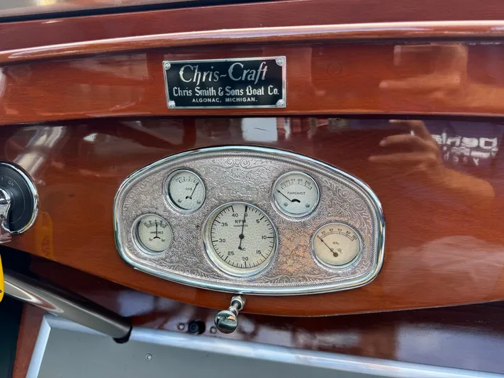 The Paragon Yacht Photos Pics Dashboard of a 1929 Chris-Craft 26 Upswept Triple Cockpit boat with vintage gauges.