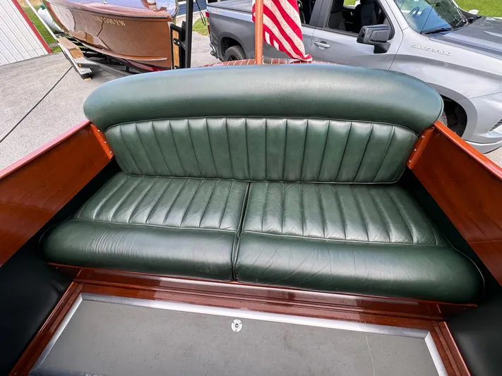 The Paragon Yacht Photos Pics 1929 Chris-Craft 26 Upswept Triple Cockpit with green leather seating and wooden interior.