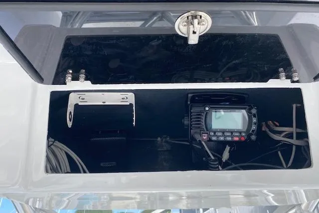  Yacht Photos Pics Storage compartment with electronic equipment on a 2025 Custom Carolina Forbes boat.