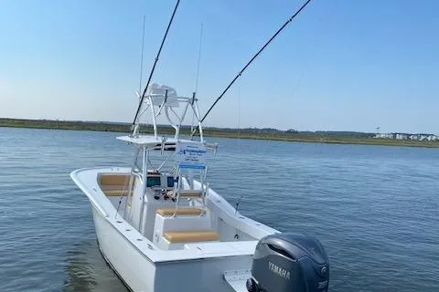  Yacht Photos Pics 2025 Custom Carolina Forbes boat with Yamaha engine on calm water.