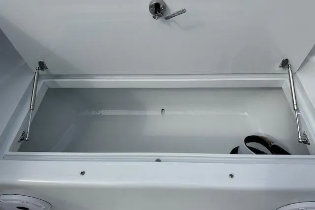  Yacht Photos Pics Open storage compartment on 2025 Custom Carolina Forbes boat, featuring hydraulic hinges.