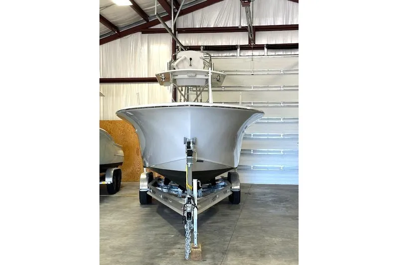  Yacht Photos Pics 2025 Custom Carolina Forbes boat on trailer in a garage setting.