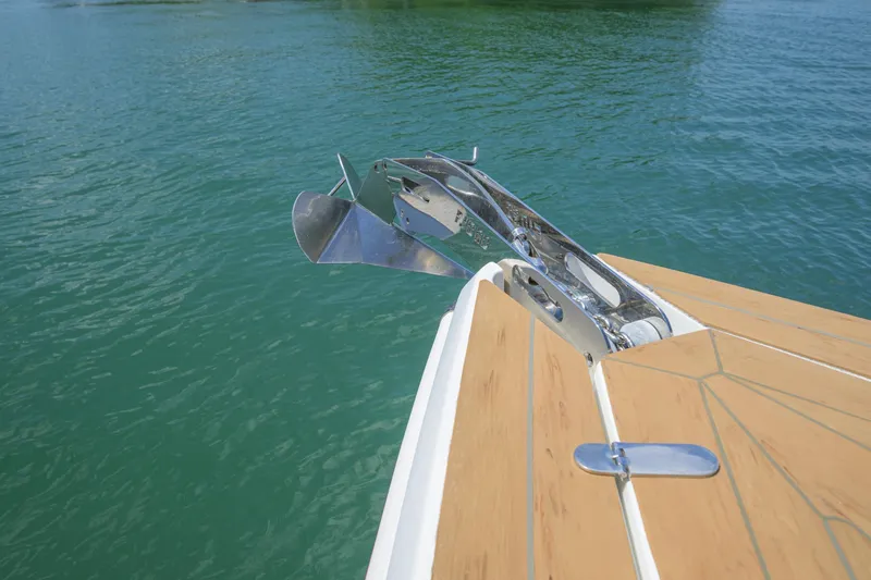  Yacht Photos Pics Bow of 2018 Fjord 36 Xpress with anchor over turquoise water.