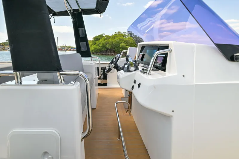  Yacht Photos Pics 2018 Fjord 36 Xpress boat interior with modern dashboard and seating.