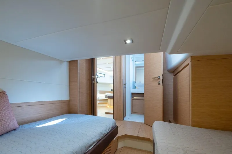 M/y Ida Yacht Photos Pics Interior cabin of 2021 Pardo Yachts 50, featuring twin beds and modern wood finish.
