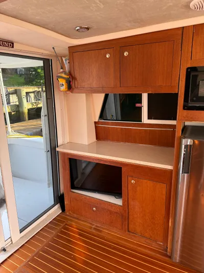  Yacht Photos Pics Interior of 2000 Mainship 390 Trawler with wooden cabinets and modern appliances.
