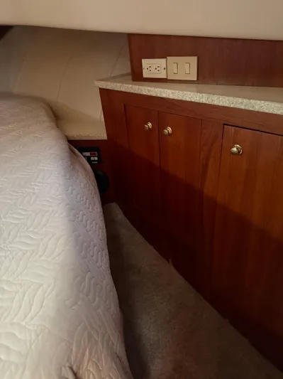  Yacht Photos Pics 2000 Mainship 390 Trawler cabin with wooden cabinets and bed.