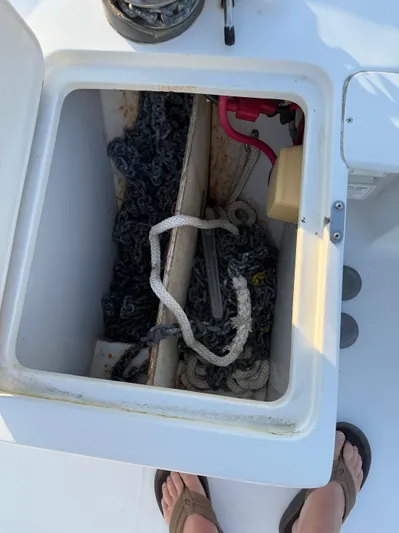  Yacht Photos Pics Storage compartment on a 2000 Mainship 390 Trawler with ropes and equipment.