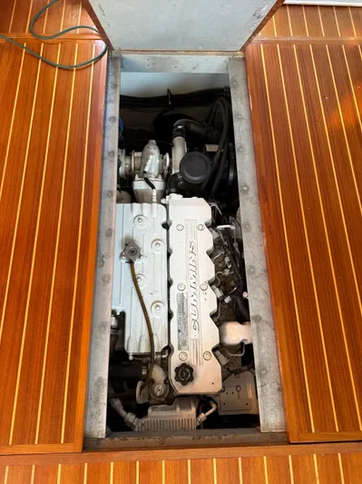  Yacht Photos Pics Engine compartment of a 2000 Mainship 390 Trawler, showcasing a well-maintained marine engine.