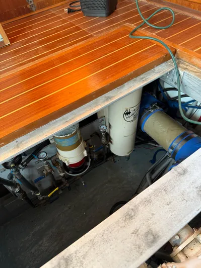  Yacht Photos Pics Engine compartment of 2000 Mainship 390 Trawler with visible filters and equipment.