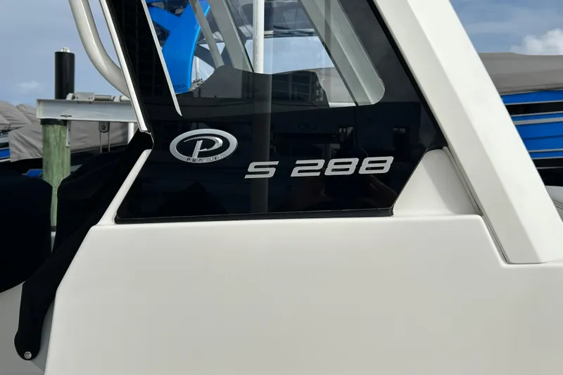  Yacht Photos Pics 2023 Pursuit S 288 Sport boat side view with logo and model name.