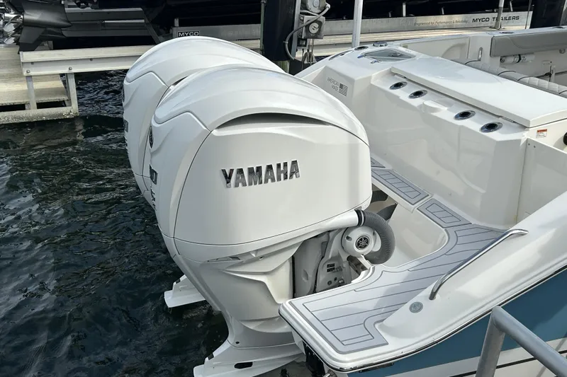  Yacht Photos Pics 2023 Pursuit S 288 Sport boat with twin Yamaha outboard engines docked.