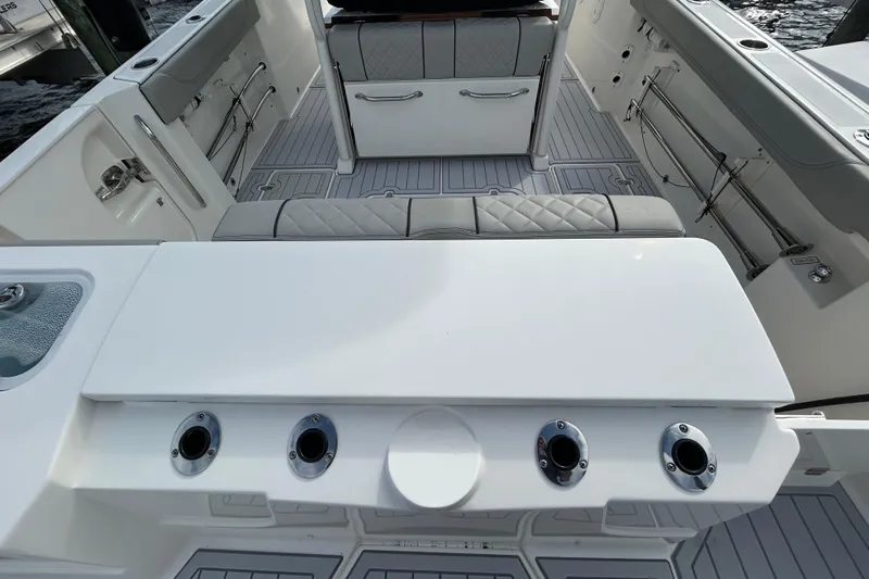  Yacht Photos Pics 2023 Pursuit S 288 Sport boat interior with seating and rod holders.