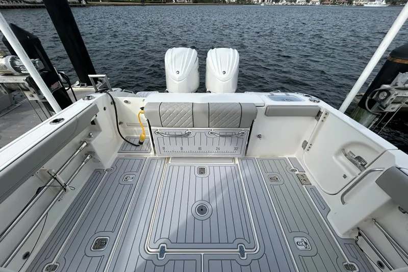  Yacht Photos Pics 2023 Pursuit S 288 Sport boat deck with dual engines, spacious layout, and sleek design.