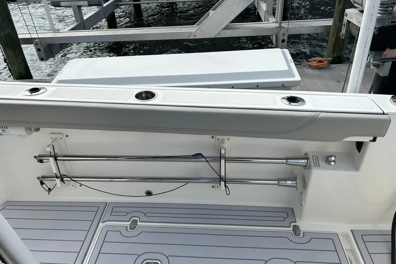  Yacht Photos Pics 2023 Pursuit S 288 Sport boat interior with rod holders and deck view.