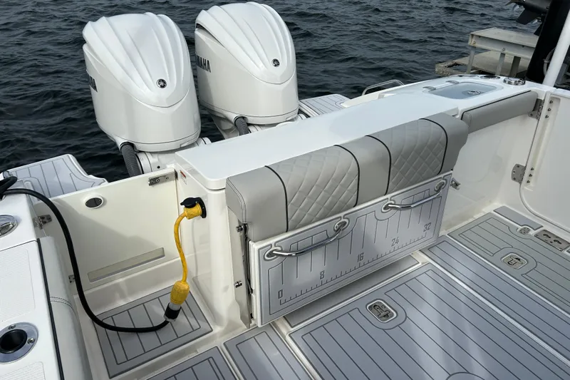  Yacht Photos Pics 2023 Pursuit S 288 Sport boat with dual Yamaha engines and cushioned seating.